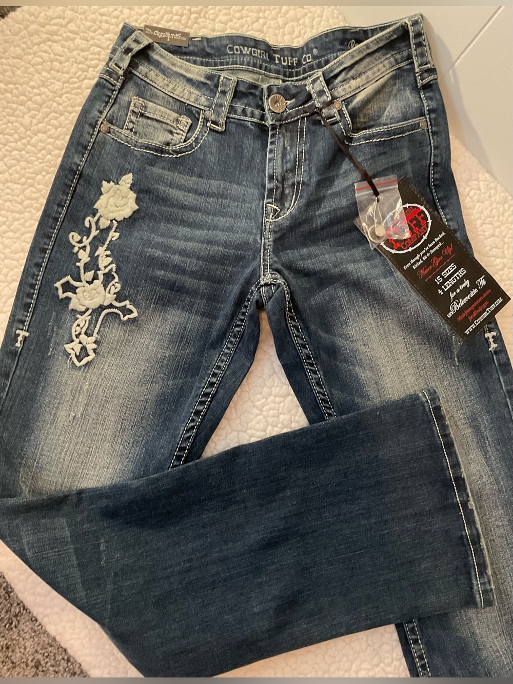 Cowgirl Tuff “Roses & Faith” Bootcut Jeans with White Floral Embroidery.